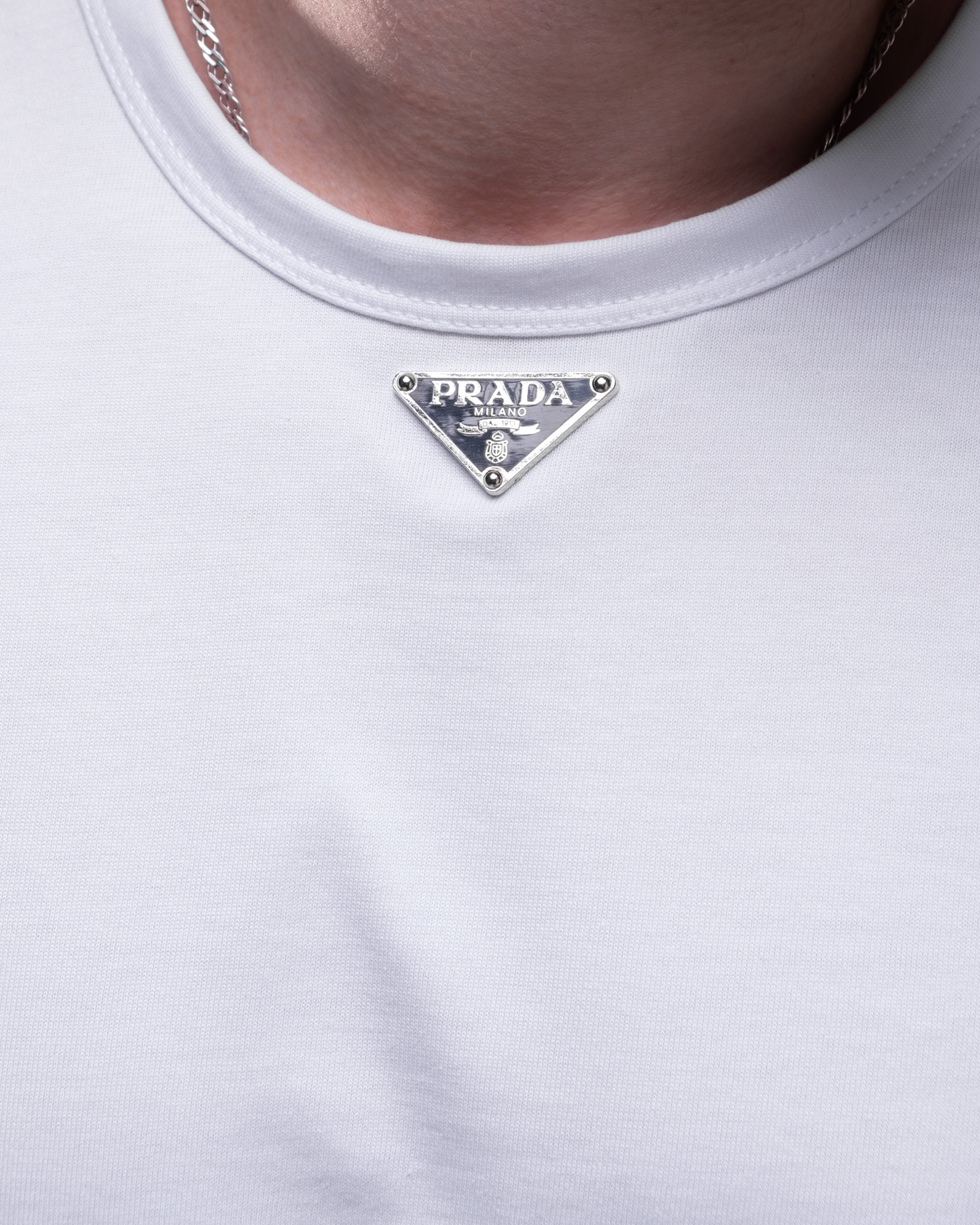 Prada T-Shirt – White Cotton with Metal Logo Badge
